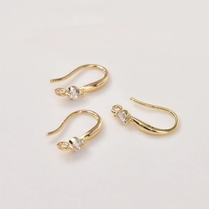 Close-up of 14K gold plated earring hooks with round cubic zirconia for DIY jewelry