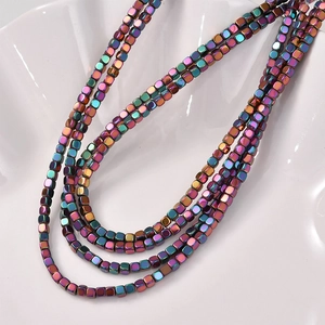 Macro shot of 3mm rainbow metallic hematite cube beads for DIY jewelry making