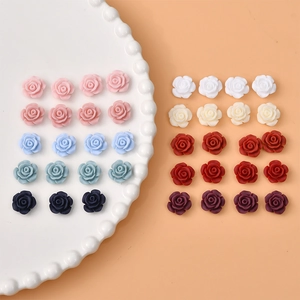 Close-up of 12mm colorful resin rose flower charms for DIY jewelry and nail art