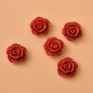 Detail showing five red resin 12mm rose flower cabochons for DIY jewelry making and crafts