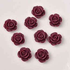 Detailed view of 12mm dark purple resin camellia flower charms for DIY jewelry making