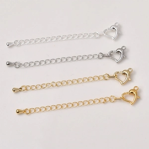 Detail of 14K gold and silver heart lobster clasp extender chains for DIY jewelry making