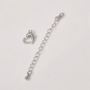 Detail of silver heart lobster clasp and extension chain for DIY jewelry making