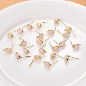 Macro detail of oval pink crystal studs with 18K gold plated base for DIY jewelry making