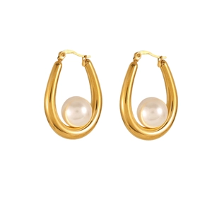 Golden chunky hoop earrings featuring a single round pearl inlay on a polished surface