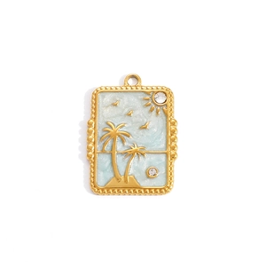 Detail of gold rectangular pendant with blue enamel sea waves and palm tree charm