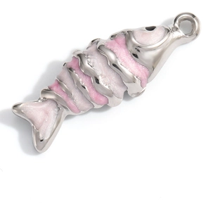 Macro detail of fish-shaped stainless steel pendant with pink and white glitter inlay