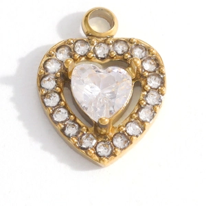 Macro shot of gold heart pendant with central clear zircon and micro-pave halo setting