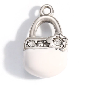 Detailed macro view of heart purse charm with white enamel finish and zircon inlay