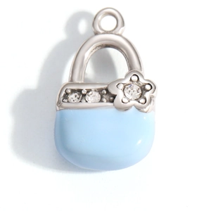Detail of blue enamel handbag charm with silver frame and zircon flower decoration