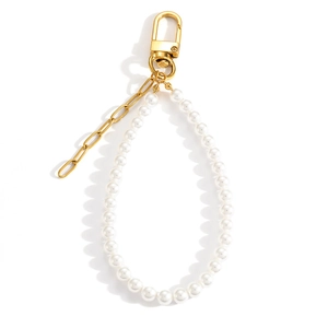 Detail of elegant gold clasp and chain with white pearls for DIY bag charm accessories