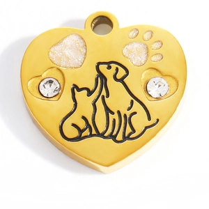 Gold heart-shaped pet ID tag featuring embossed cat and dog silhouettes with rhinestones
