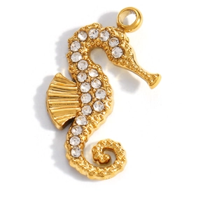Detailed close-up of golden seahorse pendant with sparkling crystals and fine textures
