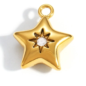 Macro detail of gold plated star pendant with central zircon for DIY jewelry making