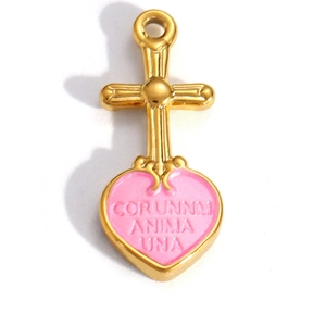 Detailed close-up of golden cross and pink enamel heart pendant with Latin engraving