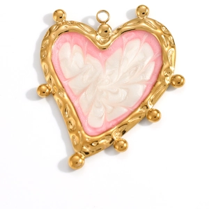 Detail of a gold-plated heart pendant with pink and white enamel scales and embossed texture