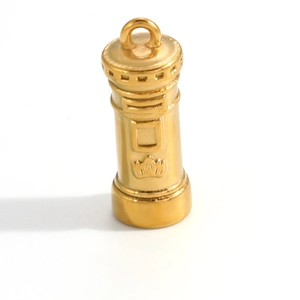 Detailed close-up of a gold-plated mailbox pendant with crown relief and top hanging loop