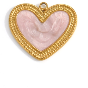 Macro shot of a pink heart pendant with golden beaded border and glossy enamel texture