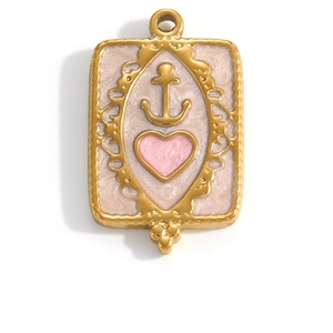 Detail of a rectangular gold-plated anchor pendant with pink enamel and a tiny heart