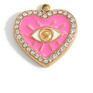 Macro detail of heart-shaped evil eye pendant with pink enamel and sparkling rhinestones