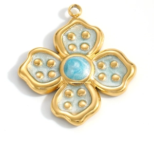 Detail of flower pendant with gold plating and blue glitter enamel inlay for jewelry