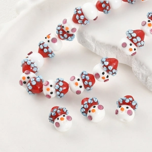 Handmade glass snowman charm beads in red and white for Christmas jewelry making