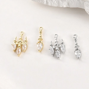Detailed macro of gold and silver plated chandelier pendants with zircon stones for DIY jewelry