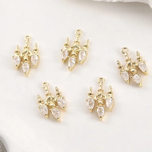 Detailed macro view of vintage gold plated chandelier pendants with cubic zirconia crystals