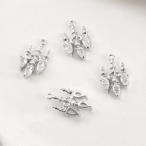 Macro view of vintage chandelier pendants with silver metal and pear-shaped zircons