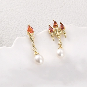 14k gold plated drop earrings featuring orange-red crystal and white pearl accents