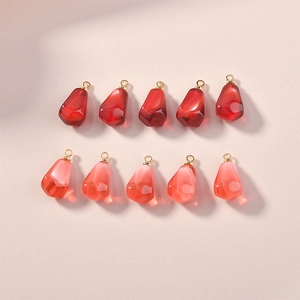 Realistic pomegranate seed resin pendants in red and pink colors with gold loops for DIY jewelry