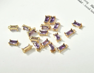 Detail of rectangular purple crystal pendants with 18k gold plating for DIY jewelry making