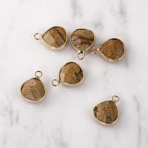 Set of six vintage teardrop stone pendants with gold metal edges and natural brown textures