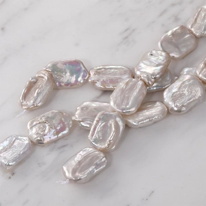 Detail of natural iridescent baroque rectangular freshwater pearls for DIY jewelry making