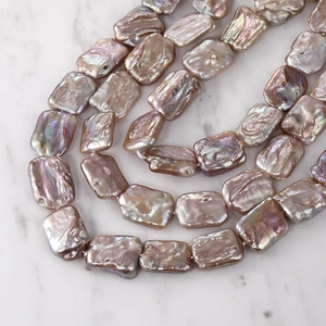 Macro shot of rectangular baroque pearls with iridescent luster for DIY jewelry making