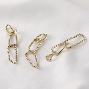 14k gold plated twisted link chain for DIY jewelry making on white silk background