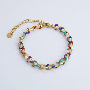 Close-up of 18k gold plated chain bracelet with colorful enamel links and heart charm