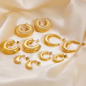 Polished 18k gold plated stainless steel earring set on premium champagne silk fabric