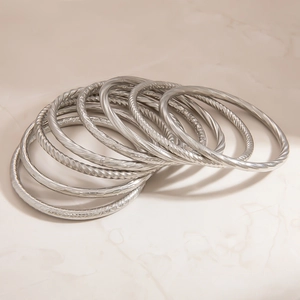Set of stackable silver twisted rope and hammered texture stainless steel bangles