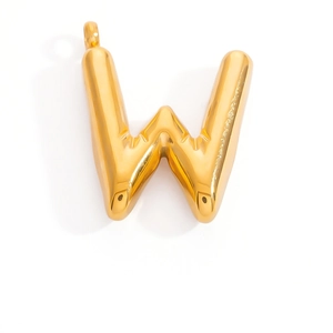 Close-up of polished 3D balloon style letter W pendant in shiny gold plated finish
