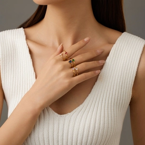 Zircon stainless steel ring set in gold with multi-colored gemstones on model