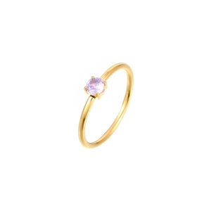 Detailed view of a light purple zircon stone in a 4-prong setting on a gold band ring