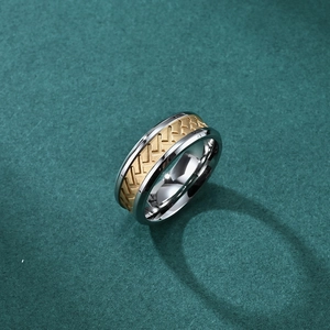 Dual-tone stainless steel tire tread ring with gold inlay and V-shaped textured engraving