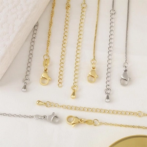 Detail of assorted gold and silver plated chains including box and O-link styles