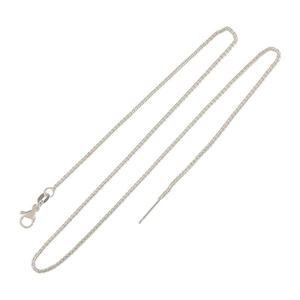 Detailed macro view of 18k gold-plated pin chain with lobster clasp and needle end