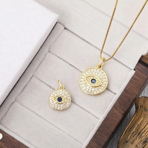 Golden round Evil Eye necklace and pendant set with blue stone and pavé zircons