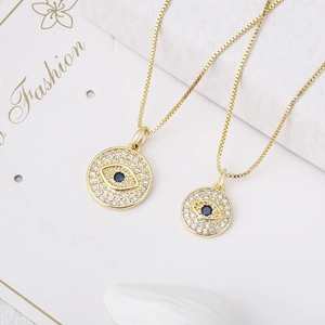 Golden Evil Eye pendant necklace set with blue center stone and white zircon accents