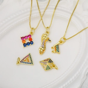 Gold pendant necklaces with multicolor zircons in geometric shapes on a white frame