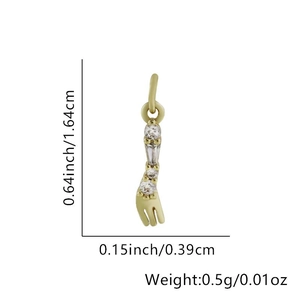 Macro detail of a gold pendant with dimensions 1.64cm length and four sparkling zircons