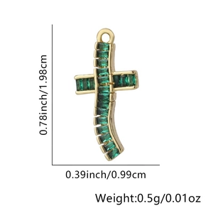 Detail view of 18k gold cross pendant with green stones and precise dimension markings